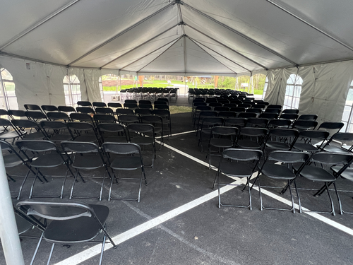 Black folding chairs available for corporate event rentals in Northeast Ohio from Broadview Rental.