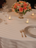 Imperial striped ivory linens at a wedding table.